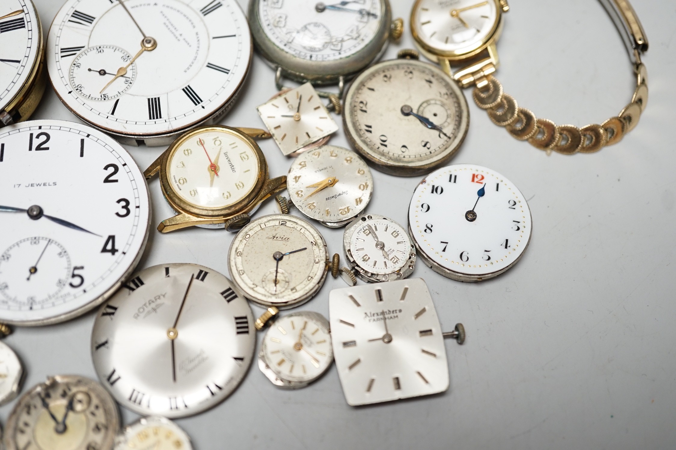 A collection of assorted wrist and pocket watch parts.